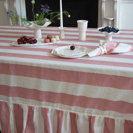 Tablecloth with colourful stripe design and ruffled edges