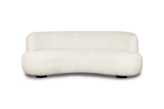 A sumptuous sofa with a curved design and boucle upholstery 
