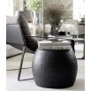 Textured black metal side table with bulging silhouette