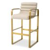 Cream linen upholstered bar stool with horizontal fluting and brass frame