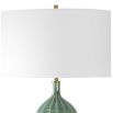 Table lamp with green glossy base and cream shade