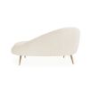 Elegant chaise longue upholstered in cream boucle with brass stiletto legs