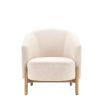 Sumptuous upholstered armchair with curved back and natural wooden legs