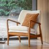 Stunning armchair with wooden frame and boucle seat pads