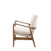 Stunning armchair with wooden frame and boucle seat pads