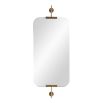 Wall mirror with rounded edges and brass wall fixtures at the top and bottom