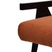 boucle burnt orange armchair with wooden frame