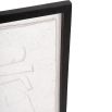 Cream coloured abstract wall art in a black frame 