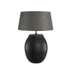 Large black metal table lamp with organic textured finish, shade not included