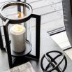 Large lantern with modern black metal frame and glass candle holder