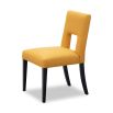 Dining chair with square cut out shape in backrest and luxurious mustard linen upholstery