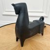 Black matte horse sculpture with chipped feet