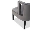 Grey chair with softly curved backrest and cut-out feature