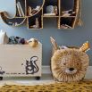 Rattan-like storage basket with lion face on front