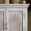 ornate sunburst design cabinet in light wash finish