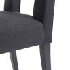 Dark grey dining chair with square cut out shape in backrest and luxurious linen upholstery