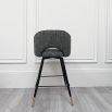 Sleek, swivel counter stool with elegant brass caps