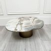 marble-topped table with brush brass base