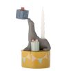 Quaint candle holder in the shape of a seal for children's birthday