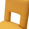 Dining chair with square cut out shape in backrest and luxurious mustard linen upholstery