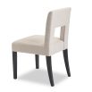 Beige dining chair with square cut out shape in backrest and luxurious linen upholstery