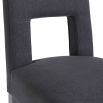 Dark grey dining chair with square cut out shape in backrest and luxurious linen upholstery