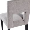 Light grey dining chair with square cut out shape in backrest and luxurious linen upholstery