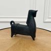 Black matte horse sculpture with chipped feet