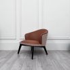 Mid-Century inspired armchair with two materials and contrasting black ash legs  