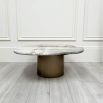 marble-topped table with brush brass base