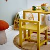 Wooden yellow chair with low back