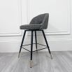 Sleek, swivel counter stool with elegant brass caps