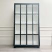 A sophisticated black display cabinet with tempered glass. A few scuffs and glue marks