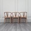 Set of three natural birch wishbone dining chairs