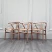 Set of three natural birch wishbone dining chairs