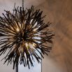 Black chandelier with bursting branches