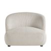 cream rounded armchair in soft ribbed fabric