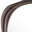 An organically shaped mirror by Eichholtz with a textured bronze highlight finish