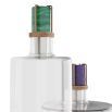 Glass decanters, one with green and brass topper and one with purple and brass topper