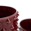 Set of two red vases with geometric spike details