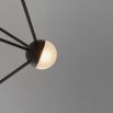 An industrial style chandelier by Schwung with a geometric design, seven transparent glass shades and a black gunmetal 