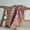 Quilt with warm and bohemian patterns and offwhite back