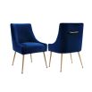 A luxury dining chair by Liang & Eimil with a classic design, brass detailing and a beautiful blue velvet upholstery