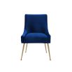 A luxury dining chair by Liang & Eimil with a classic design, brass detailing and a beautiful blue velvet upholstery