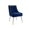 A luxury dining chair by Liang & Eimil with a classic design, brass detailing and a beautiful blue velvet upholstery