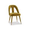 Upholstered mustard chair with lavish velvet and tapered legs