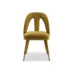 Upholstered mustard chair with lavish velvet and tapered legs