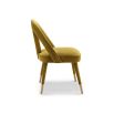 Upholstered mustard chair with lavish velvet and tapered legs