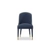 Blue velvet dining chair accented with golden-capped tapered legs