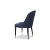 Blue velvet dining chair accented with golden-capped tapered legs